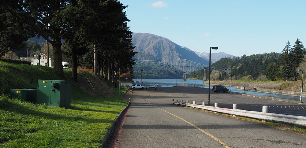 The lower parking lot today with the campsite up a small hill to the south and the Columbia River to the north.